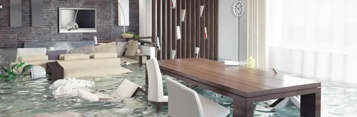 home interior affected by water damage with flooded floors and displaced furniture in Columbus, OH